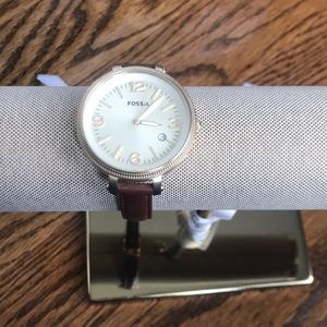 Gold face with tan strap fossil watch